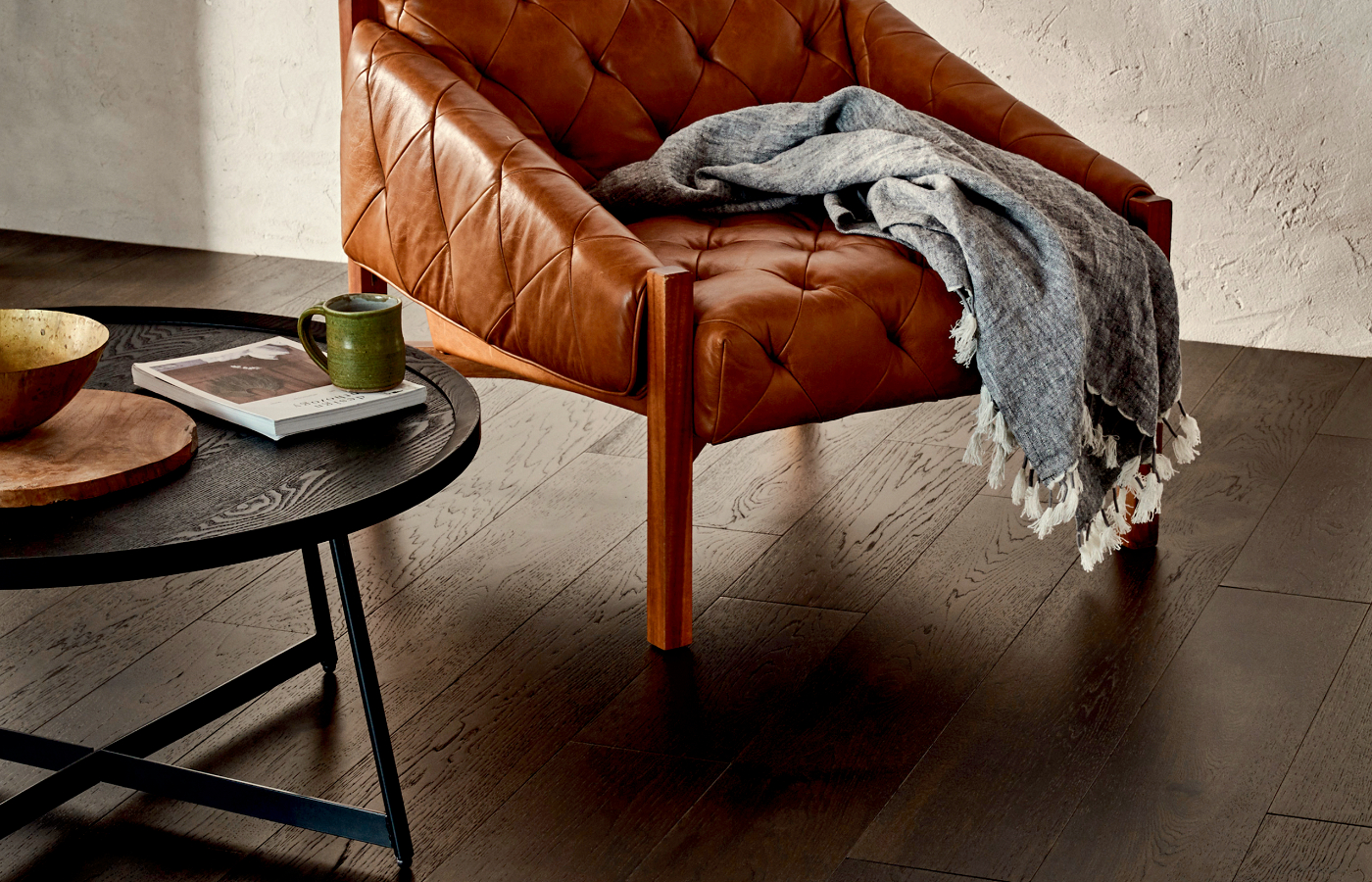 hardwood flooring in living room with leather armchair